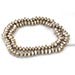 White metal beads and pendants. White metal beads and pendants.